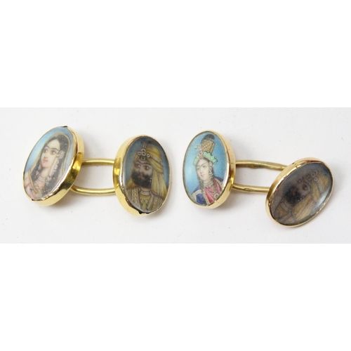 1121 - A pair of 18ct gold mounted cufflinks each set with an Indian mughal watercolour portrait of a high ... 