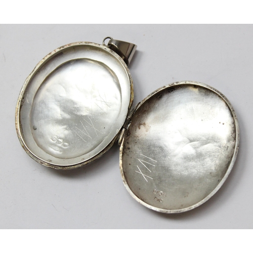 1122 - A Victorian silver locket with extensive engraved decoration, Chester 1879, approx 48mm x 40mm, appr... 