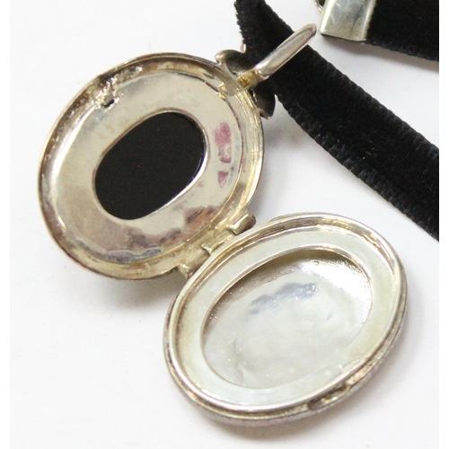 1123 - A Victorian style black enamel and silver marcasite locket, in box, approx 35mm tall