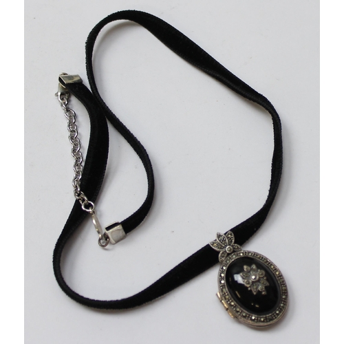 1123 - A Victorian style black enamel and silver marcasite locket, in box, approx 35mm tall