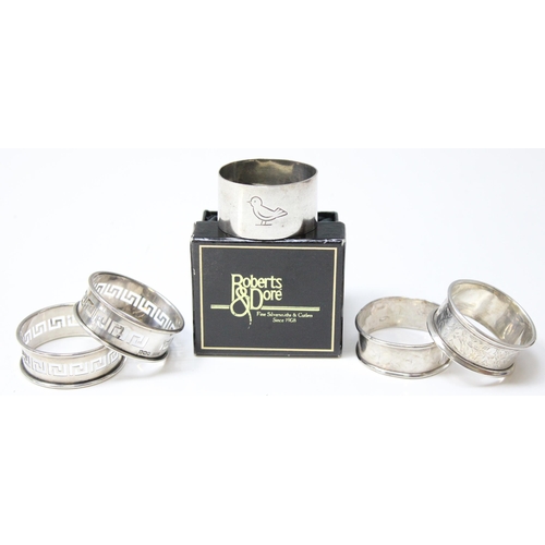 1047 - 5 assorted silver napkin rings, one boxed, various dated and makers, silver weight approx 61.62g gro... 