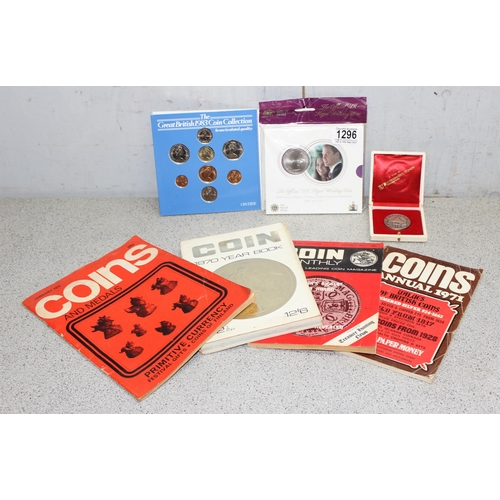 1296 - Qty of coin reference books, a 1983 coin set in case, an Italian silver Papal medallion and a Willia... 