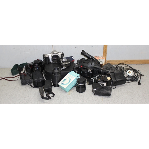 666 - Qty of camera and camera equipment to include a Canon EDS100 and a Panasonic NV-G2B