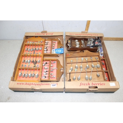 1047A - A large qty of assorted silver plated collectors spoons, spoon display racks, and assorted collector... 