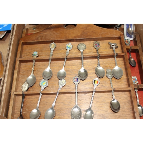 1047A - A large qty of assorted silver plated collectors spoons, spoon display racks, and assorted collector... 