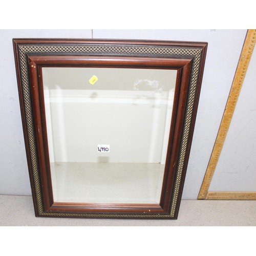 416A - 2 x mirrors - an early 20th century octagonal oak framed mirror with carved decoration and a vintage... 