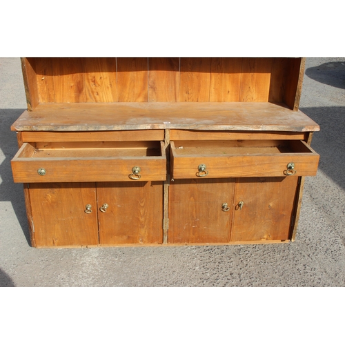 146 - A large vintage hand made rustic elm dresser, plate rack over 2 drawers over 4 cupboard doors, rusti... 