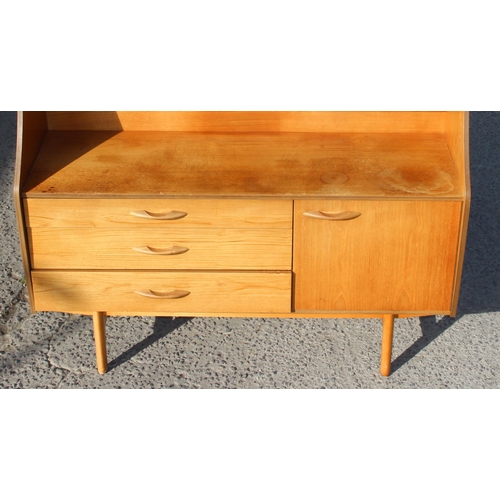 149 - A retro Avalon sideboard with various drawers and shelves, approx 135cm wide x 46cm deep x 135cm tal... 