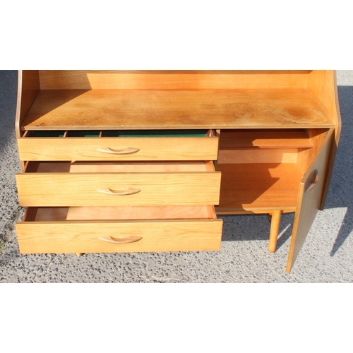 149 - A retro Avalon sideboard with various drawers and shelves, approx 135cm wide x 46cm deep x 135cm tal... 