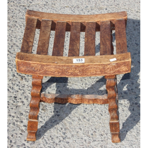 153 - Sydney W Smith, local furniture maker, an unusual early 20th century oak slatted top stool with carv... 