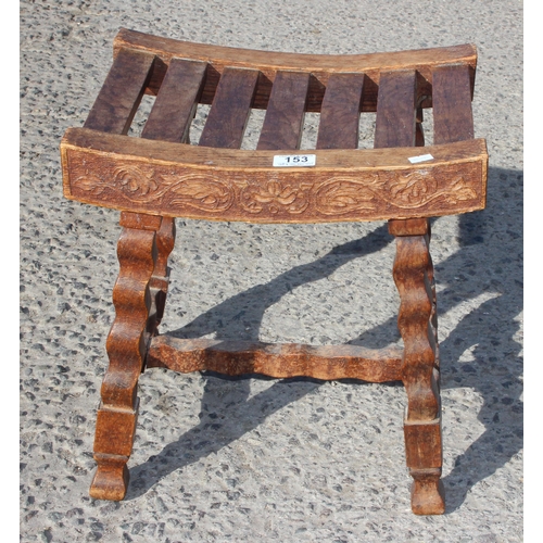 153 - Sydney W Smith, local furniture maker, an unusual early 20th century oak slatted top stool with carv... 