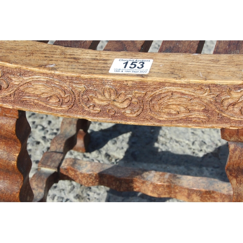 153 - Sydney W Smith, local furniture maker, an unusual early 20th century oak slatted top stool with carv... 