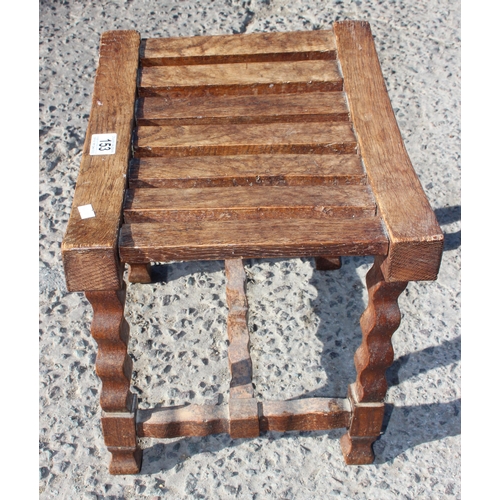 153 - Sydney W Smith, local furniture maker, an unusual early 20th century oak slatted top stool with carv... 