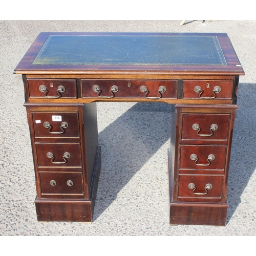 156 - A small vintage leather topped pedestal desk with drop handles, approx 93cm wide x 53cm deep x 78cm ... 