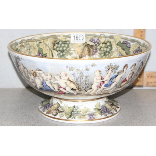 1663 - An impressive 19th century pottery punchbowl, likely by Prattware with grape and vine leaf border to... 