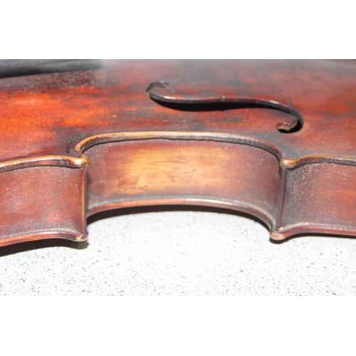 622 - An antique violin in wooden case, the violin stamped Perry Dublin to reverse, a hand written in labe... 