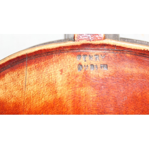 622 - An antique violin in wooden case, the violin stamped Perry Dublin to reverse, a hand written in labe... 