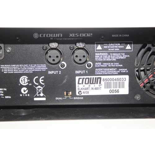 764 - Crown XLS 802 professional 1000W rack mounted power amp, with hard shell carry case