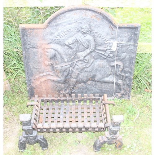 86 - A vintage cast iron fire grate and fire dogs, approx 76cm wide and an antique cast iron fire back de... 