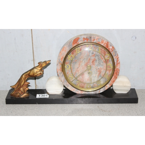 1301 - Art Deco period mantel clock with circular marble face and a leaping hound, approx 41cm wide