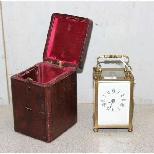 1302 - Vintage French mechanical carriage clock with key in tooled leather travelling case