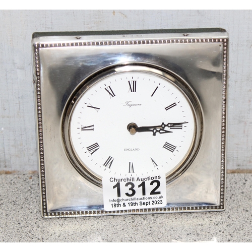 1312 - Tregawne hallmarked silver framed desk clock with green leather textured backing