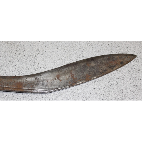 1404 - A vintage Kukri knife in sheath, seemingly unmarked and a 1951 dated leather US Police magazine hold... 