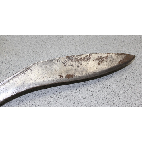 1404 - A vintage Kukri knife in sheath, seemingly unmarked and a 1951 dated leather US Police magazine hold... 