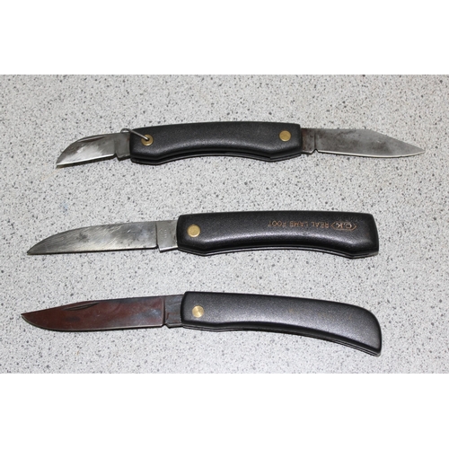 1409 - 3 black-handled folding knives, to incl a Whitby, CK lamb's foot, and a CK 9069