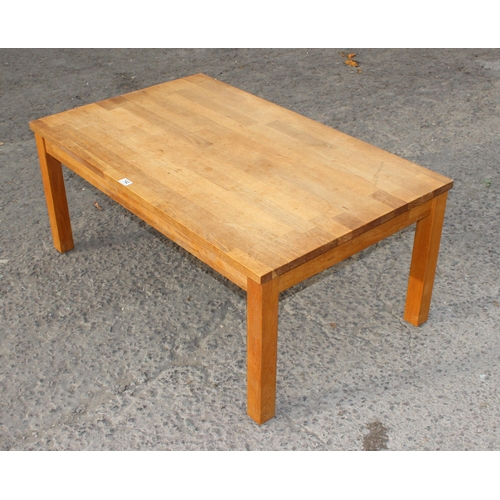 142 - A good quality modern oak coffee table with detachable legs, approx 118cm wide x 73cm deep x 57cm ta... 