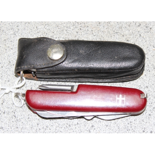 1440 - Victorinox knife in black case and a red Swiss army knife