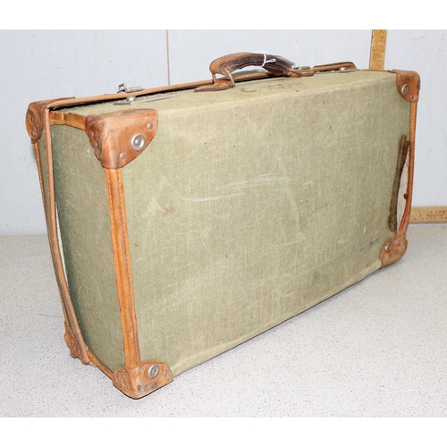 1450 - Military issue green canvas and leather trim demob suitcase - crows foot stamp to interior