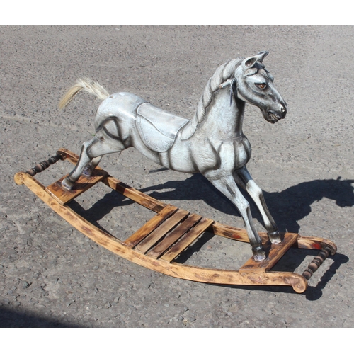 1508 - An antique style grey painted wooden rocking horse, approx 122cm wide