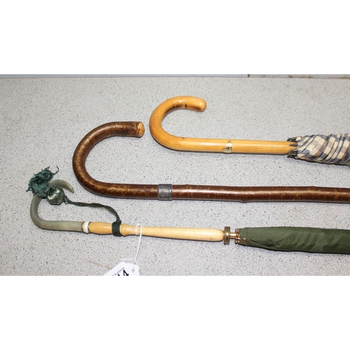 1614 - A silver mounted walking stick and 2 umbrellas, one by Aquascutum (3)