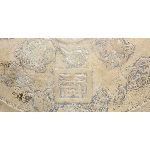 1622 - A large heavy Chinese polished bronze or brass mirror decorated with moulded characters to reverse, ... 