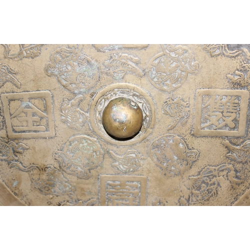 1622 - A large heavy Chinese polished bronze or brass mirror decorated with moulded characters to reverse, ... 