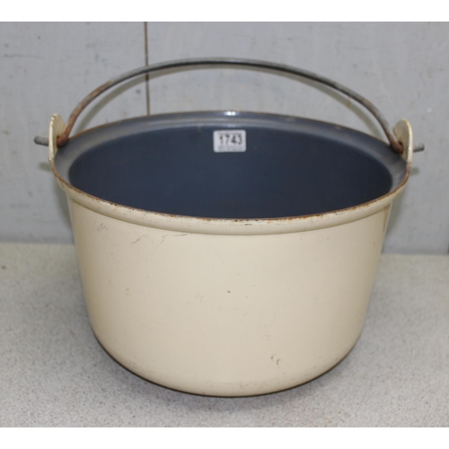 1743 - A large enamel cooking pot, approx 35cm in diameter, and a long handled metal frying pan (2)