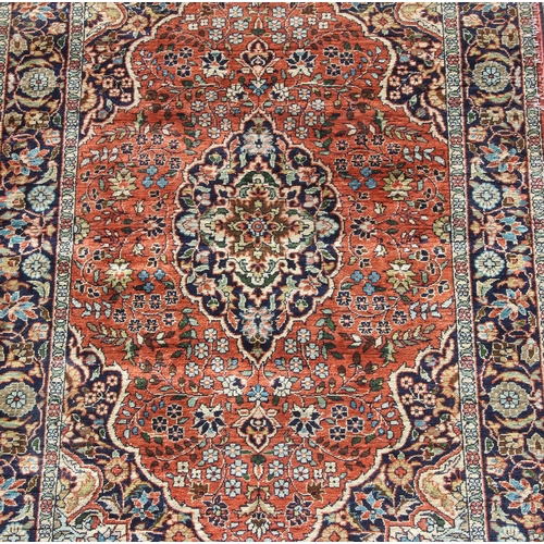 203 - A highly decorative silk Persian Kashan style rug with label verso, one of a pair matching lot 204, ... 