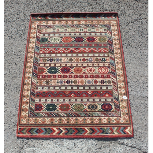 205 - A Kilim style rug by Louis de Portere, approx 199cm x 141cm