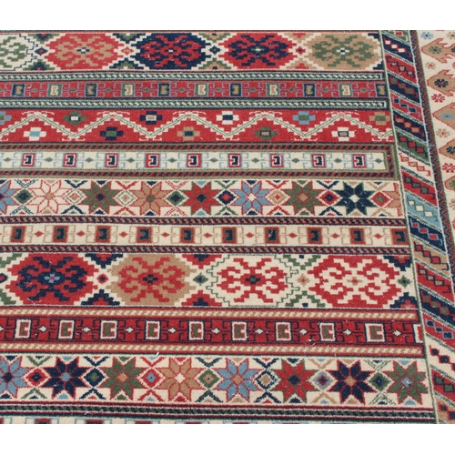 205 - A Kilim style rug by Louis de Portere, approx 199cm x 141cm