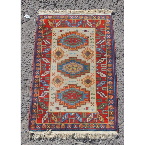 206 - A colourful vintage rug, approx 140cm x 80cm