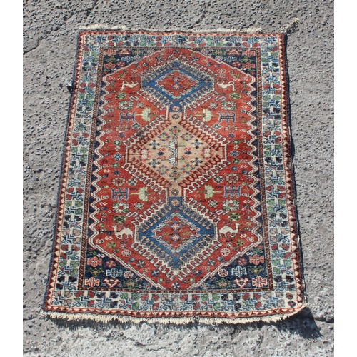 207 - A vintage Persian Yalameh rug decorated with animals, approx 146cm x 104cm