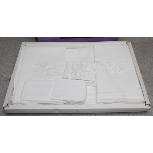 221 - Boxed set of white table linen & a boxed Japanese bed throw measuring approx 240cm x 200cm