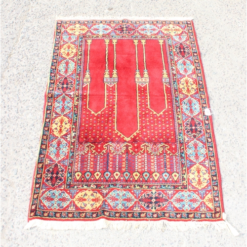 222 - Woollen hand tied red ground Anatolian prayer rug approx 166cm x 102cm