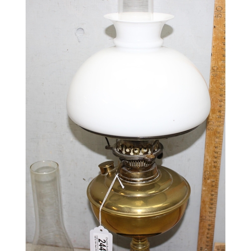 244 - Vintage oil lamp with white glass shade, approx 60cm