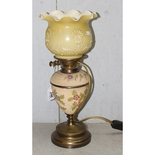 246 - Converted to electricity Messengers oil lamp with floral decoration with glass shade, approx 38cm