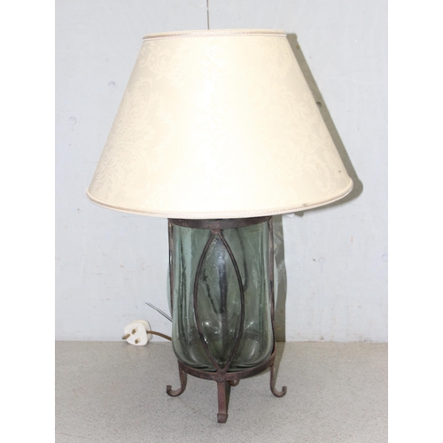 253 - Interesting hand-blown glass lamp set in wrought iron base with shade, approx 61cm tall