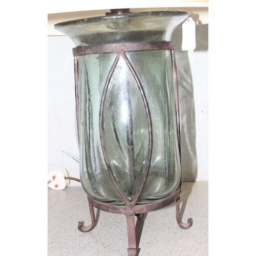 253 - Interesting hand-blown glass lamp set in wrought iron base with shade, approx 61cm tall