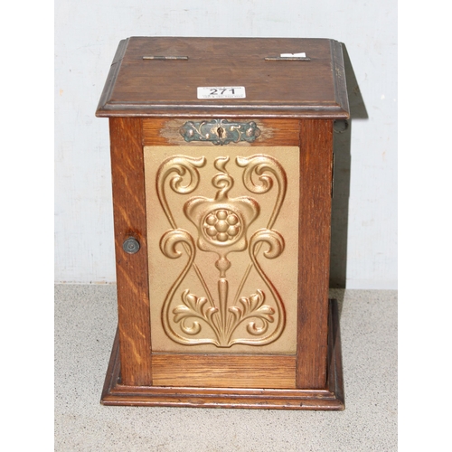 271 - Art Nouveau oak smokers cabinet with 2 pipes and a pipe tamper, approx 27cm tall x 19cm deep x 21cm ... 