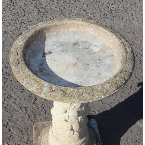 311 - A weathered garden stone birdbath, approx 68cm tall